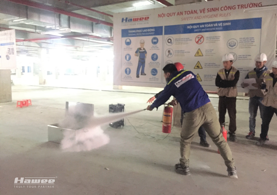 A practical training session on use of fire extinguishers at An Binh City project